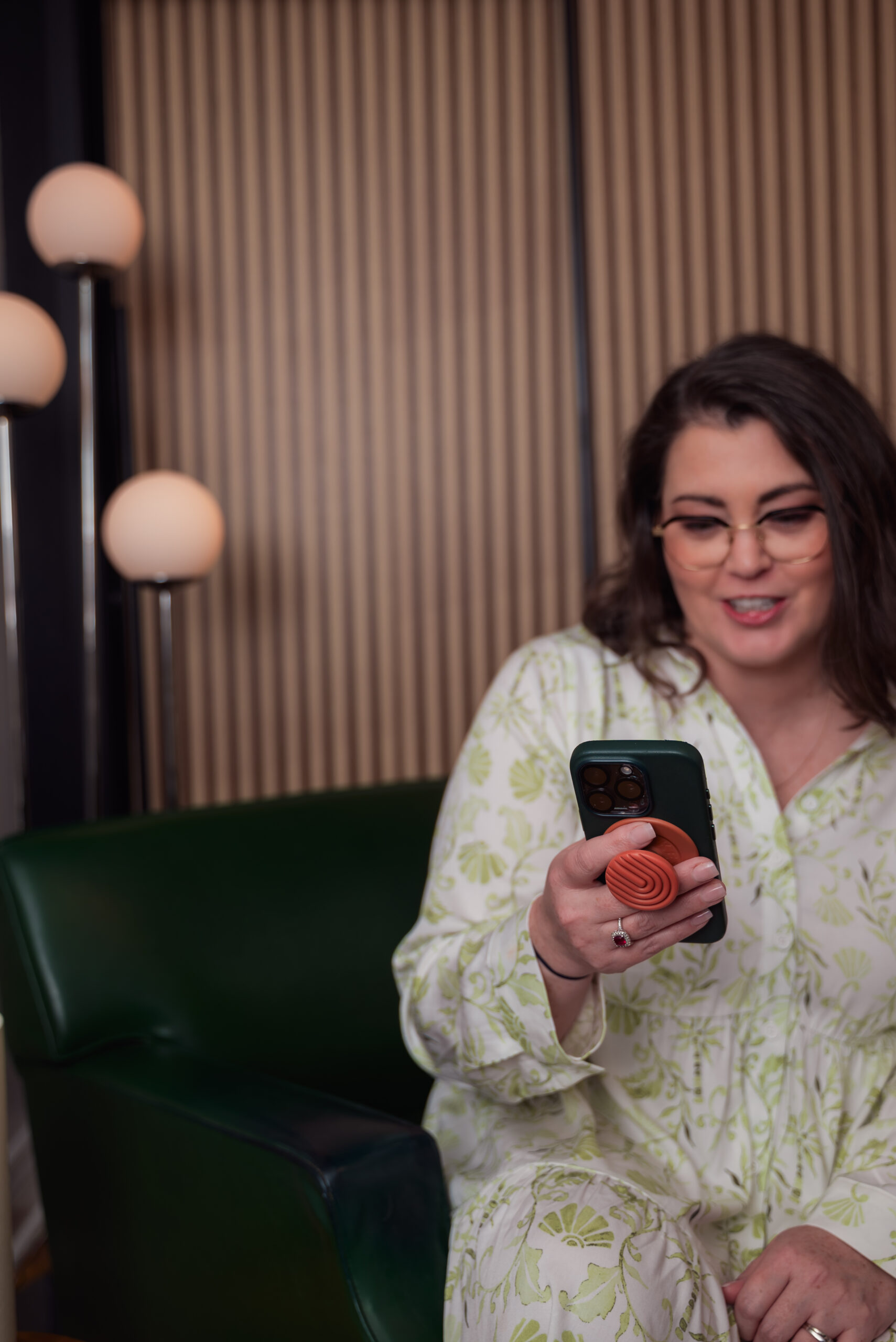 Erica Waddell, founder of Post Road Marketing, checking her messages.