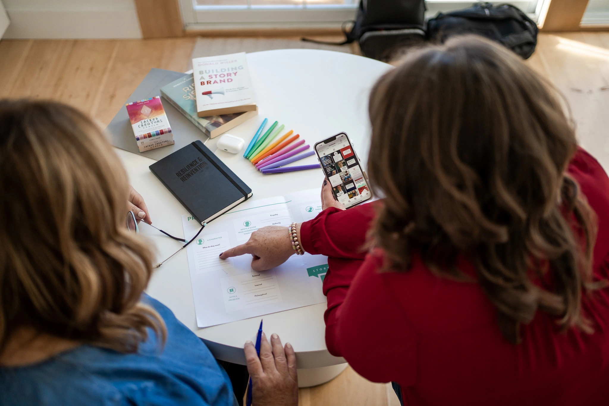 Erica Waddell working through a marketing strategy with a client