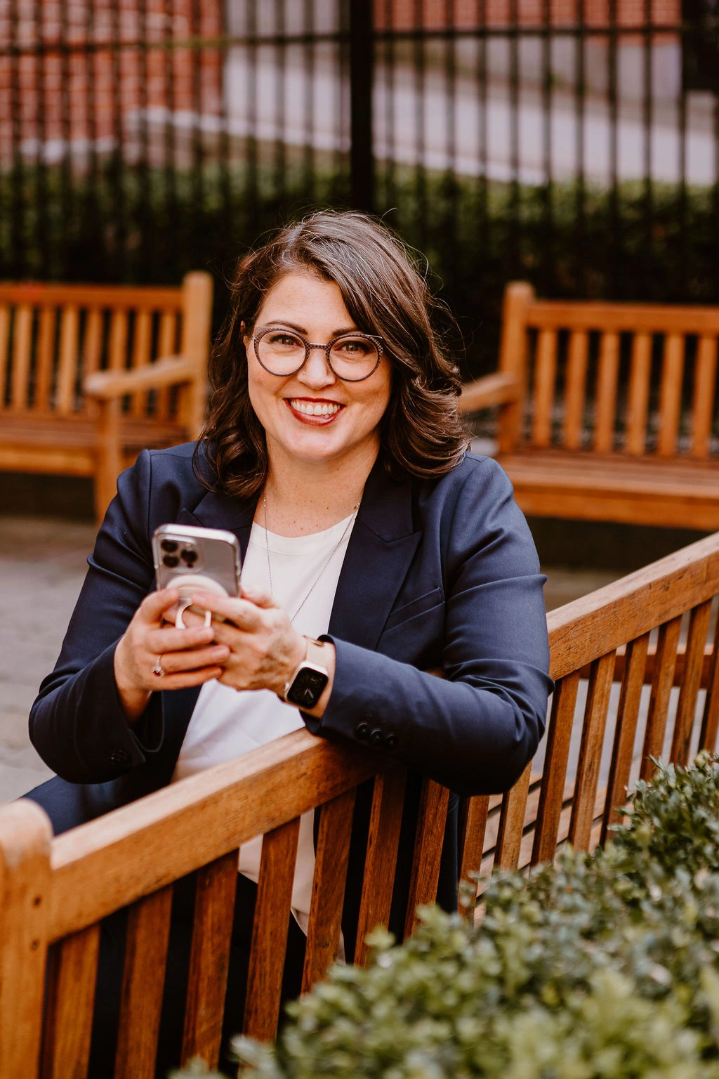 Erica Waddell of Post Road Marketing sitting outside in uptown Saint John, New Brunswick