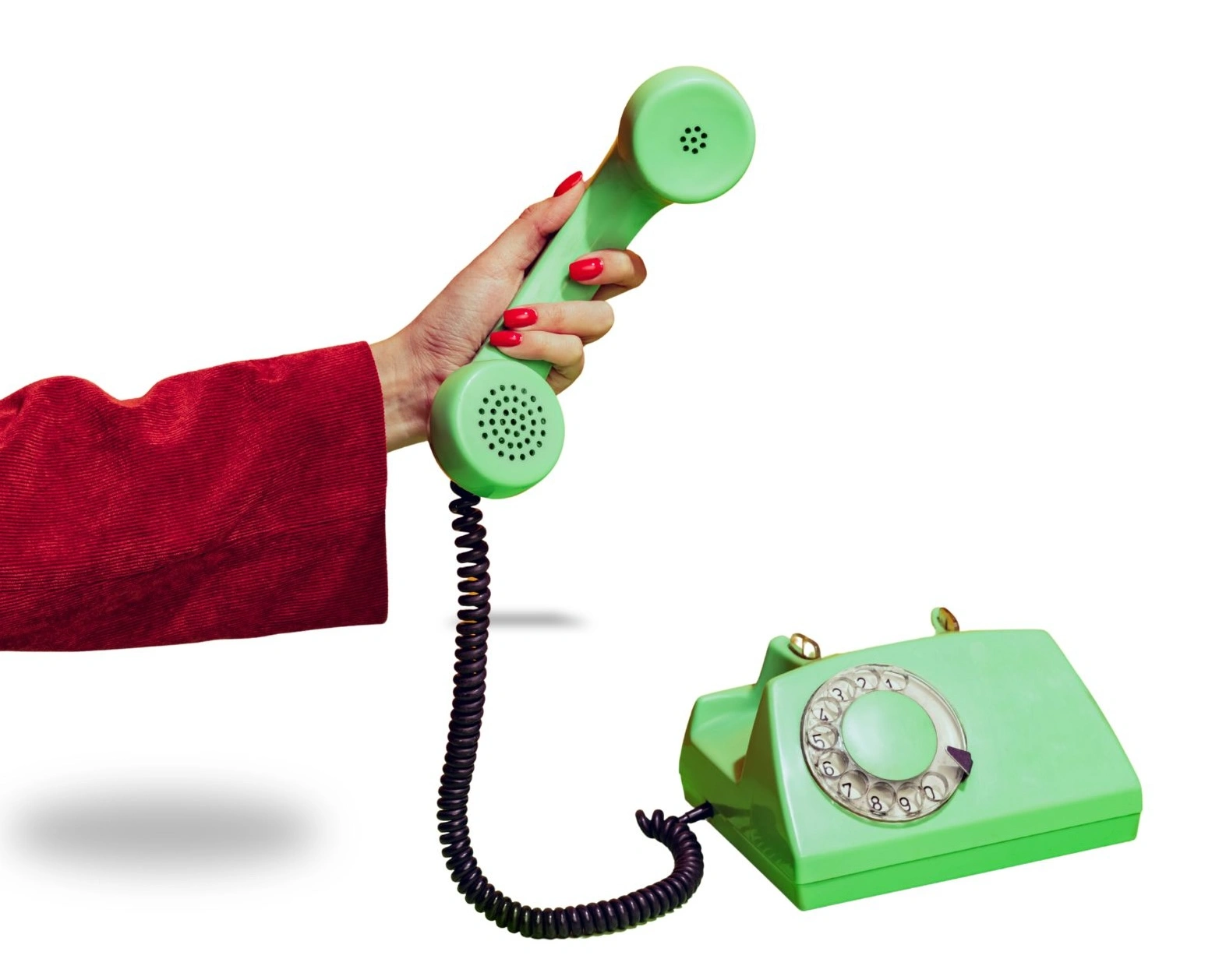 Woman's hand holding a green vintage rotary phone handset, representing the frustration of marketing messages that aren't reaching the right customers.
